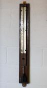 A Short & Mason stick barometer, early 20th century, with silvered dial, on oak wall mount,