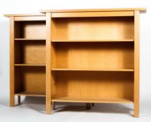 A pair of bookcases, 20th century, perhaps yew wood, each with adjustable shelves,