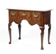 A Georgian oak lowboy, with three frieze drawers,