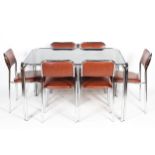 A 1970's vintage chrome dining suite comprising a tubular chrome and smoked glass table,