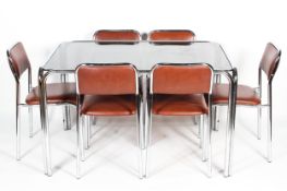 A 1970's vintage chrome dining suite comprising a tubular chrome and smoked glass table,