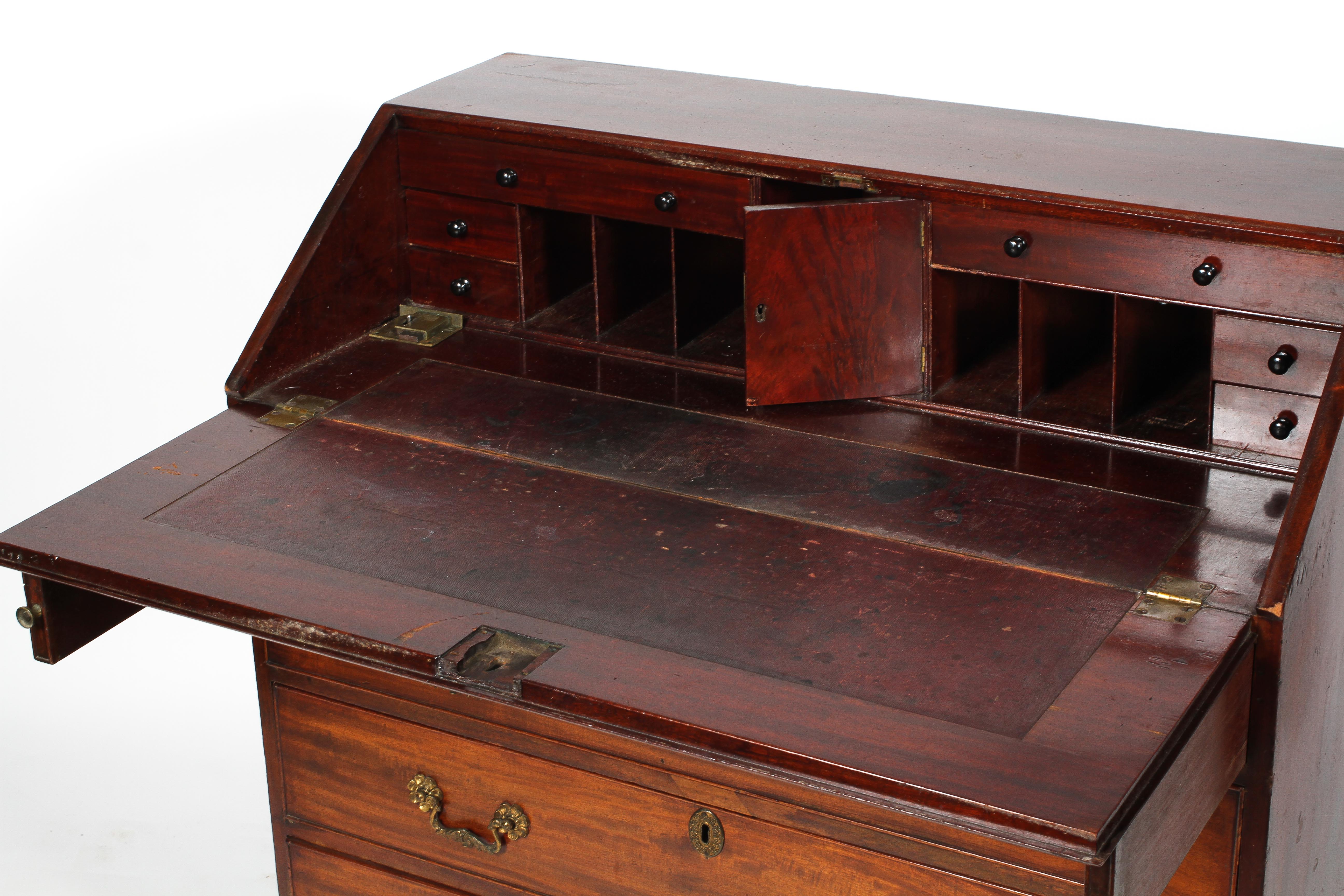 A George III mahogany bureau, the fall front enclosing a fitted interior, above four cock beaded, - Image 2 of 2