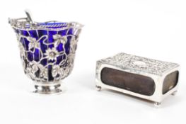 An Edwardian silver matchbox holder together with a cast silver floral and vine basket