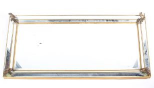 A large gilt-metal mounted bevelled edged rectangular hall mirror, 20th century,