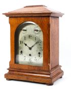 A three-train German oak bracket mantel clock, early 20th century,