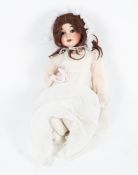 An A Lantermier bisque headed Cherie 6 doll with jointed composition body and blue sleeping eyes.