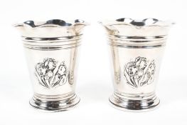 A pair of Edwardian silver floral fluted vases, cylindrical form with flowing ring,