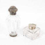 A Victorian silver mounted glass bottle, the glass of ribbed, balloon form, the lid,