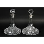 A pair of silver collared cut-glass ships decanters and stoppers, hallmarked Birmingham, 2004,