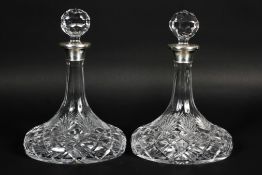 A pair of silver collared cut-glass ships decanters and stoppers, hallmarked Birmingham, 2004,