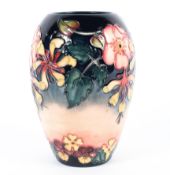 A modern Moorcroft Oberon Honeysuckle pattern oviform vase, printed,