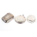 A late Victorian silver vesta case with a British silver import pill pot and another silver pot