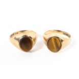 Two 9ct gold tigers eye signet rings each set with oval tigers eye panel.