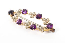 A 9ct gold amethyst and seed pearl brooch. 2.5g.