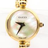 A vintage ladies Gucci quartz wristwatch, gold plated case and strap,