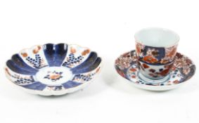 A Japanese imari pattern chocolate cup and saucer and a fluted imari pattern dish,