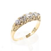 An 18ct gold and diamond five stone ring set with graduated line of old cut diamonds