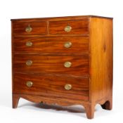 A Georgian mahogany chest of drawers, early 19th century, with reeded moulded top,