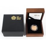 A 2009 shield of the Royal arms, 22ct gold £1 gold proof coin,