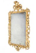 A George III giltwood and gesso rococo mirror, of rectangular form,