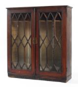 A Georgian mahogany bookcase, the double doors with hexagonal astragals,