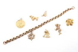 A 9ct rose gold charm bracelet with 9ct and unmarked yellow metal chain,