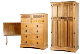 A carved limed oak part bedroom suite, 20th century,