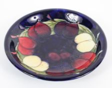 A small Moorcroft dish with Leaf and Berries pattern, 20th century, impressed mark, blue signature,