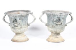 A pair of lead garden camana-shaped two-handled urns, late 19th/early 20th century,
