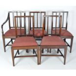 Four dining chairs and one carver with upholstered drop in seats,