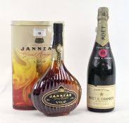 A bottle of Moet & Chandon 'Premiere cuvee' Champagne with a boxed bottle of Janneau Grand Armagnac