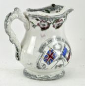 A Ynysmeudwy pottery crimean war commemorative jug, with a moulded twig-handle,