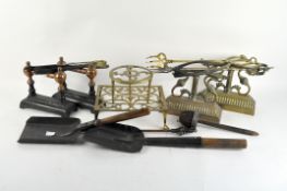 A selection of antique metalware, to include doorstops, a poker,
