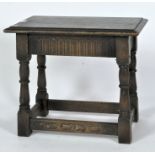 A carved oak joint stool, of rectangular form,