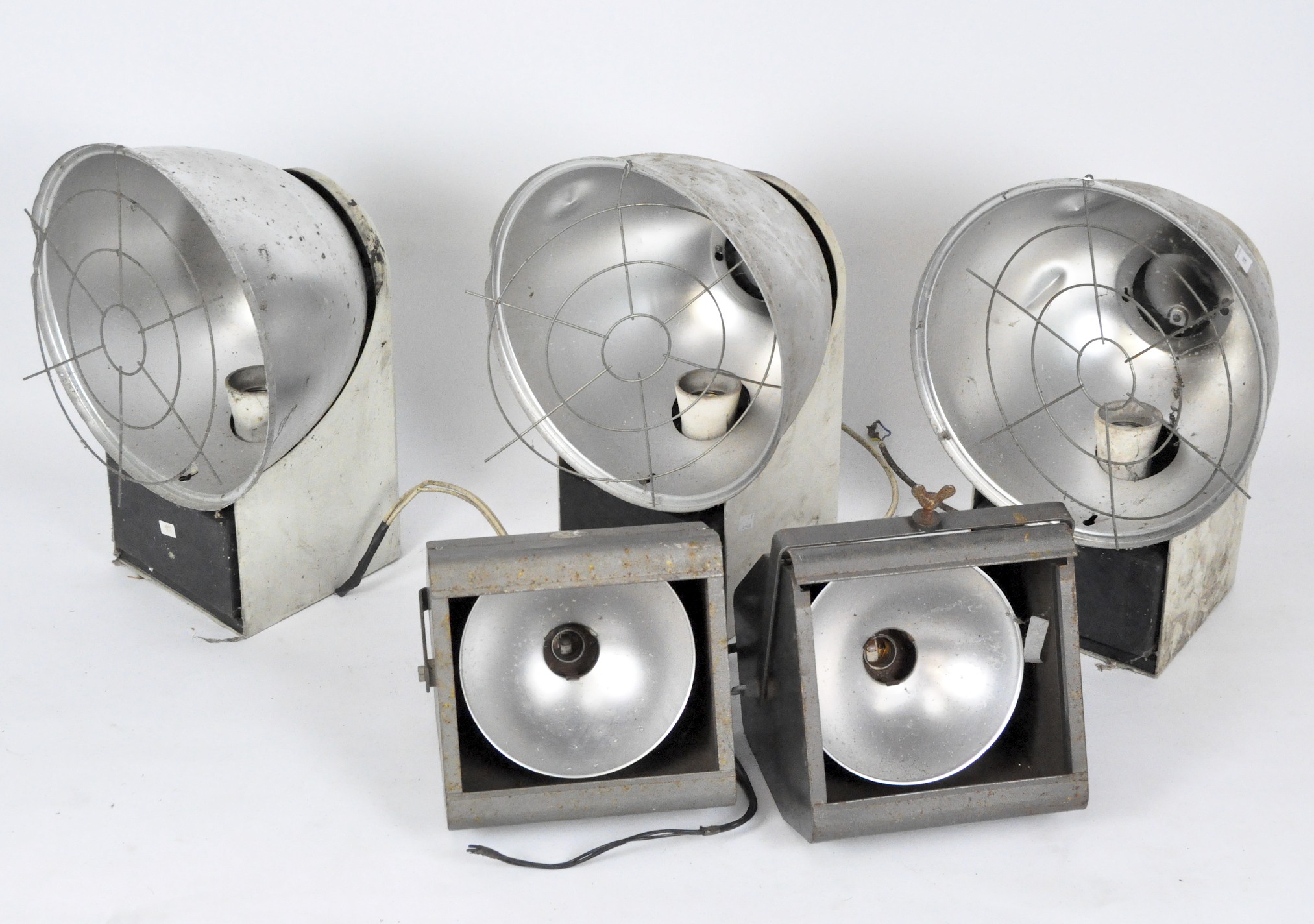 Two Strand pattern 137 theatre spot lamps, together with three industrial lights