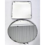 Two wall mirrors, one with bevelled edge of oval form,