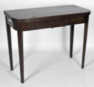 A Victorian mahogany gateleg table, with curved edges and banded decoration,