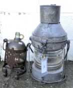 A lantern and a ship's alcohol bottle with stand,