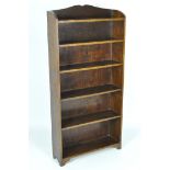 An oak bookshelf, five shelves, 118cm x 59cm x 17cm.