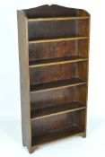 An oak bookshelf, five shelves, 118cm x 59cm x 17cm.