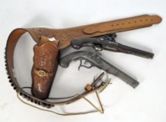 Two reproduction flintlock style guns,