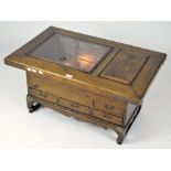 A 20th century Japanese Hibachi table, with part glazed top and single lidded compartment,