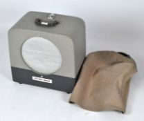 A vintage loudspeaker with carry handle and linen cover. 40cm x 43cm x 25cm.