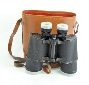 A pair of Tohyoh binoculars, 10x50, 288ft at 100 yds, in tan leather case,