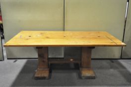 A large pine kitchen table. 105cm x 69cm x 195cm.