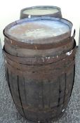 Two coopered wooden barrels,