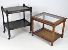 A vintage dark stained oak food trolley together with a contemporary coffee table