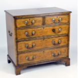 An antique style filing cabinet with side handles,