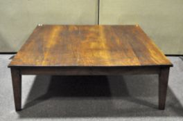 A large plank top low coffee table with peg joints, 137cm x 122cm x 43cm.