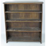 An early 20th century oak bookcase, with four fixed shelves,